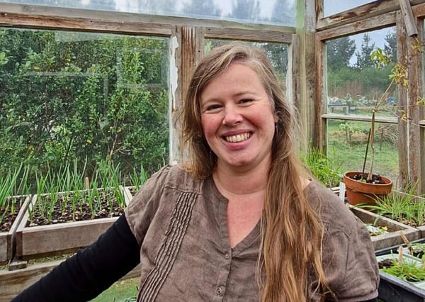 The adorable Setha Davenport of Setha's Seeds standing in her potting shed
